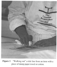 Walking out a tide line from and item with a piece of damp paper towel or cotton.