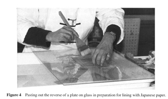 Pasting out reverse of a plate on glass in preparation for lining